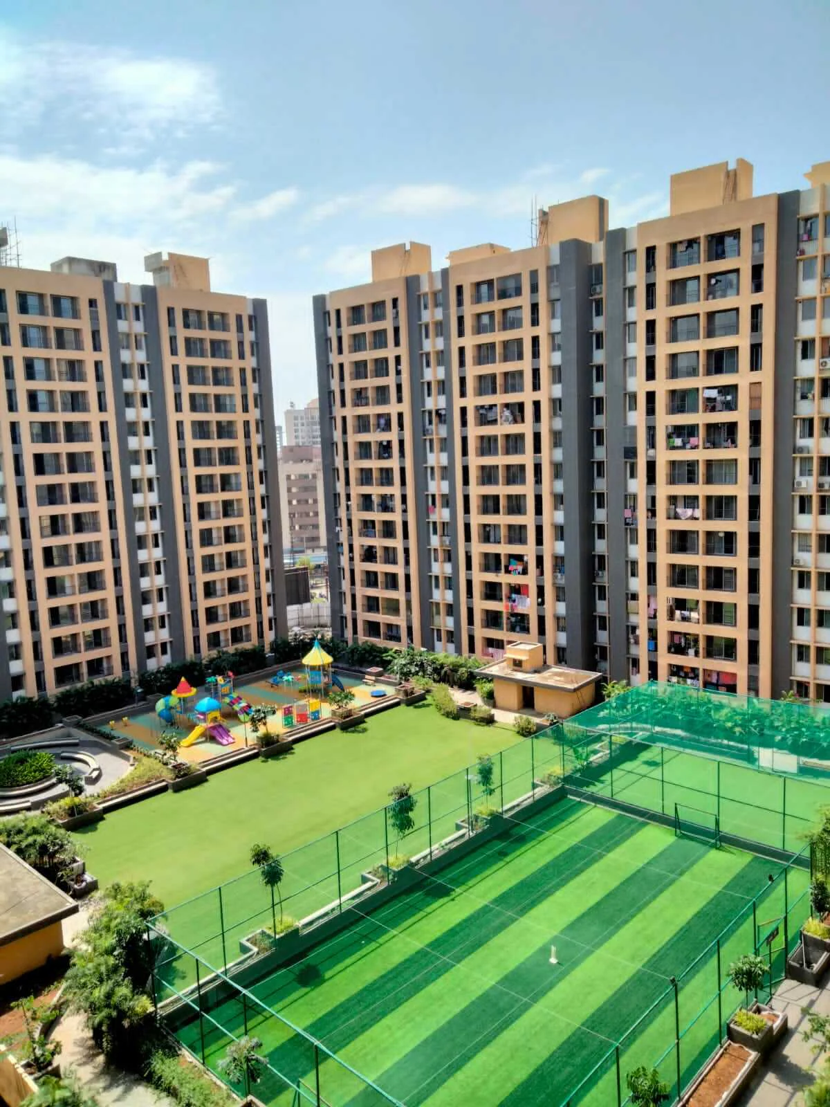 Rooftop courtyard with playground and sports court